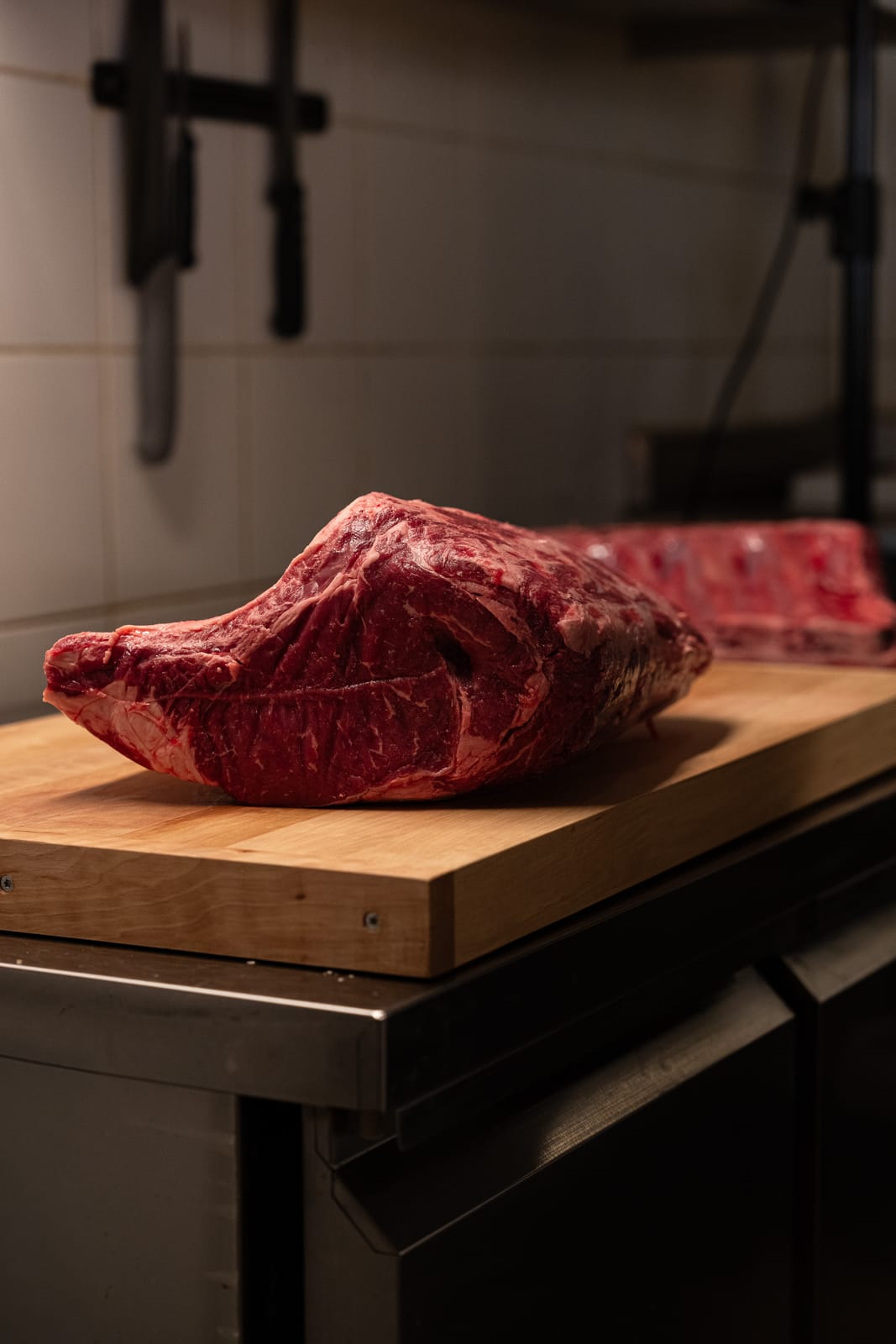 Raw Limousin côte de bœuf on a wooden block
